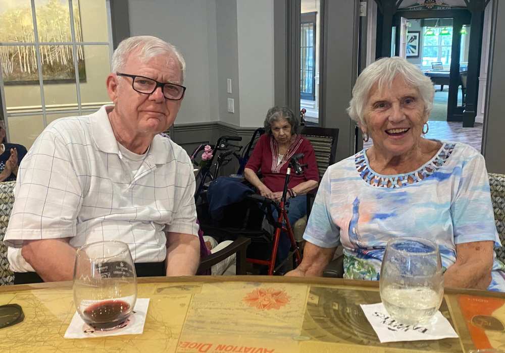 Resident couple enjoying some wine at Merrill Gardens at West Chester in West Chester, Pennsylvania
