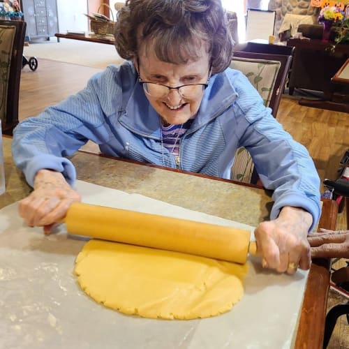 Resident rolling dough at The Oxford Grand Assisted Living & Memory Care in Wichita, Kansas