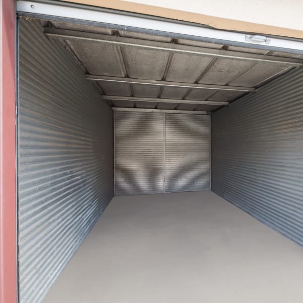 Inside a large drive up storage unit at StorQuest Economy Self Storage in Austin, Texas
