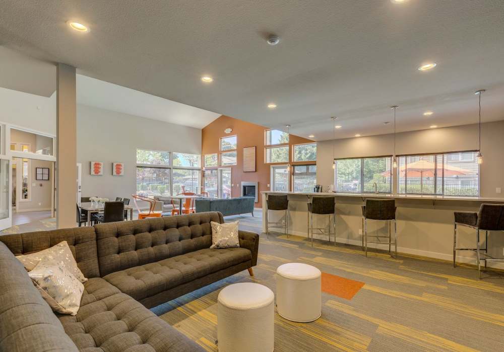 Clubhouse seating with view of clubhouse kitchen at Foundry on Fifth in Renton, Washington
