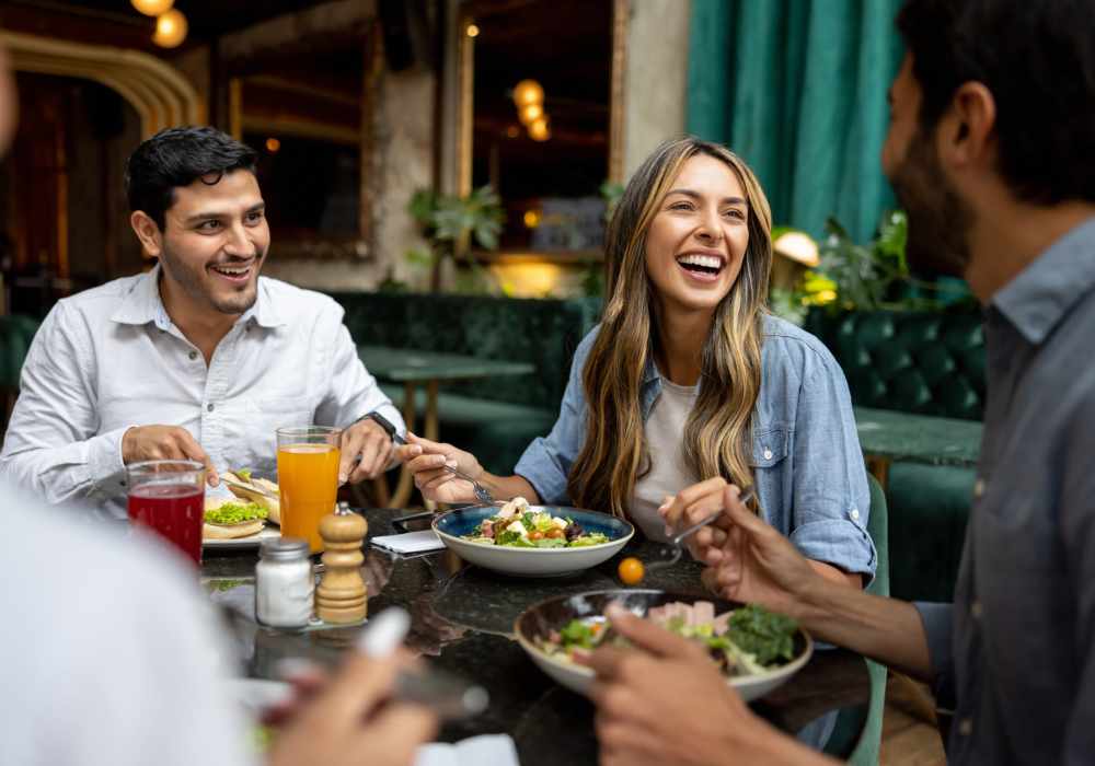 Friends having lunch at a restaurant near Orleans at Fannin Station in Houston, Texas