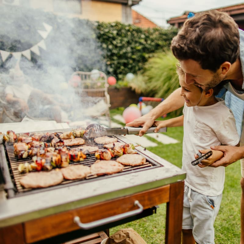 Father and son barbeque at Attain at Quarterpath, Williamsburg, Virginia