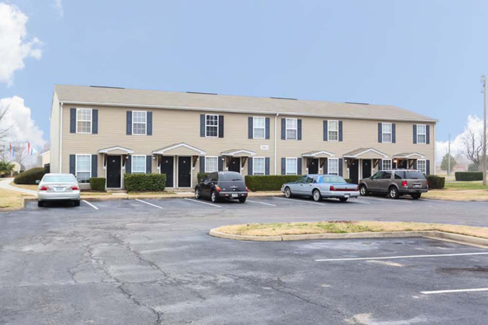 Community exterior shot with parking area at Landmark Apartments in Chesapeake, Virginia