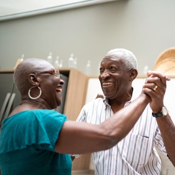 Resident couple dancing together at Vernon Terrace of Edina in Edina, Minnesota