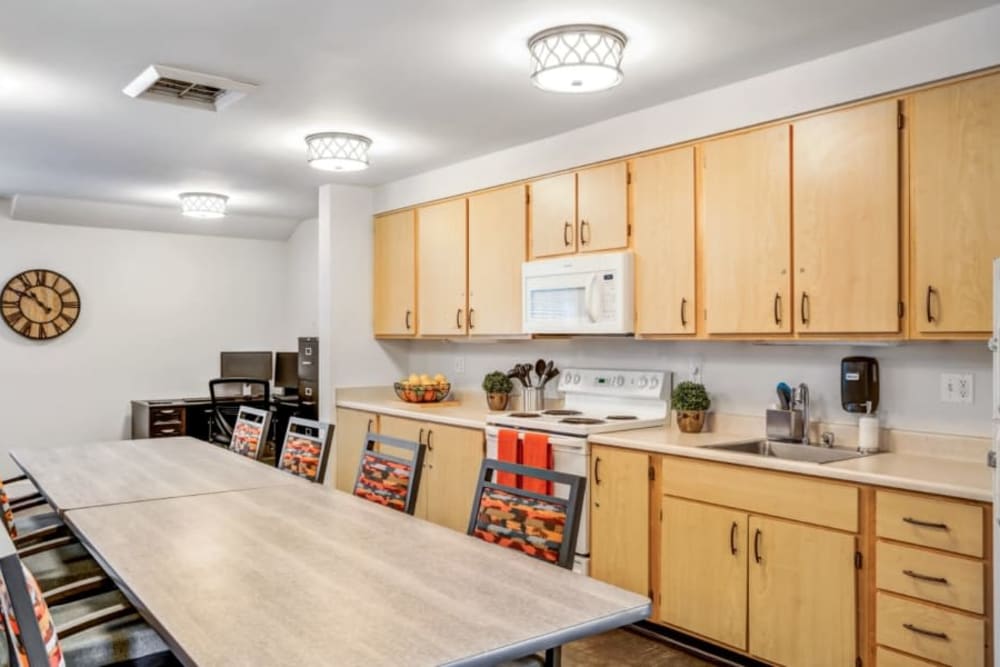 Communal kitchen with seating at Woodside Senior Living in Springfield, Oregon