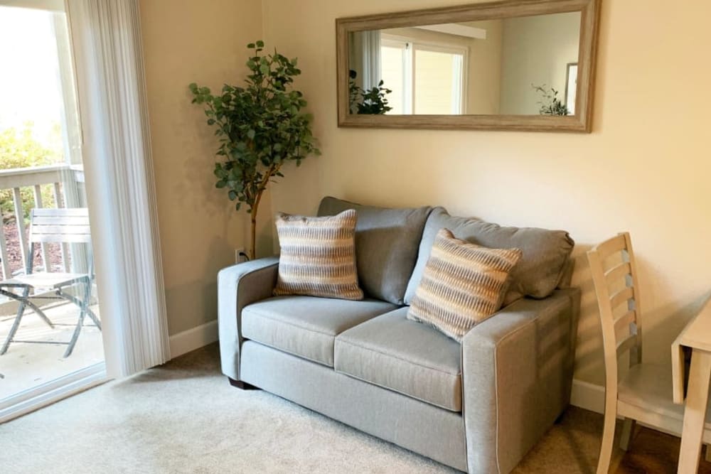 A resident living room in apartment at Blossom Vale Senior Living in Orangevale, California.