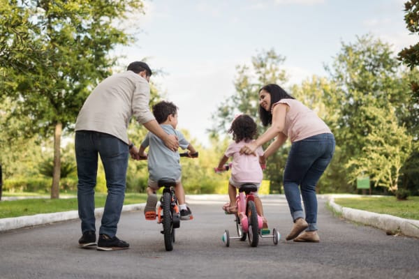 Residents pushing their kids on bikes near Haven Hill Exchange in Atlanta, Georgia