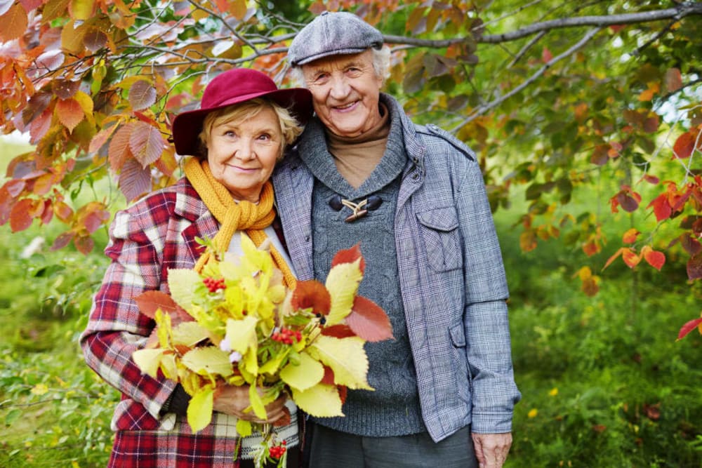 Two smiling residents at Honeysuckle Senior Living in Hayden, Idaho. 