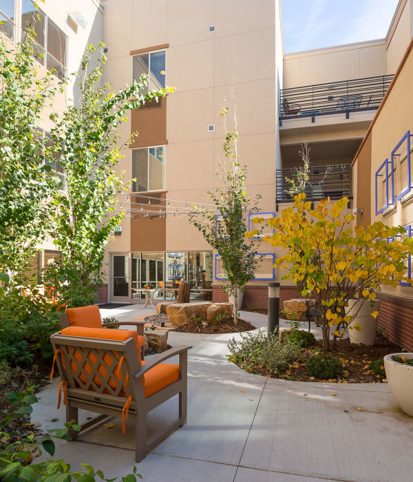 View of the courtyard at Village at Belmar with comfortable seating on a beautiful day