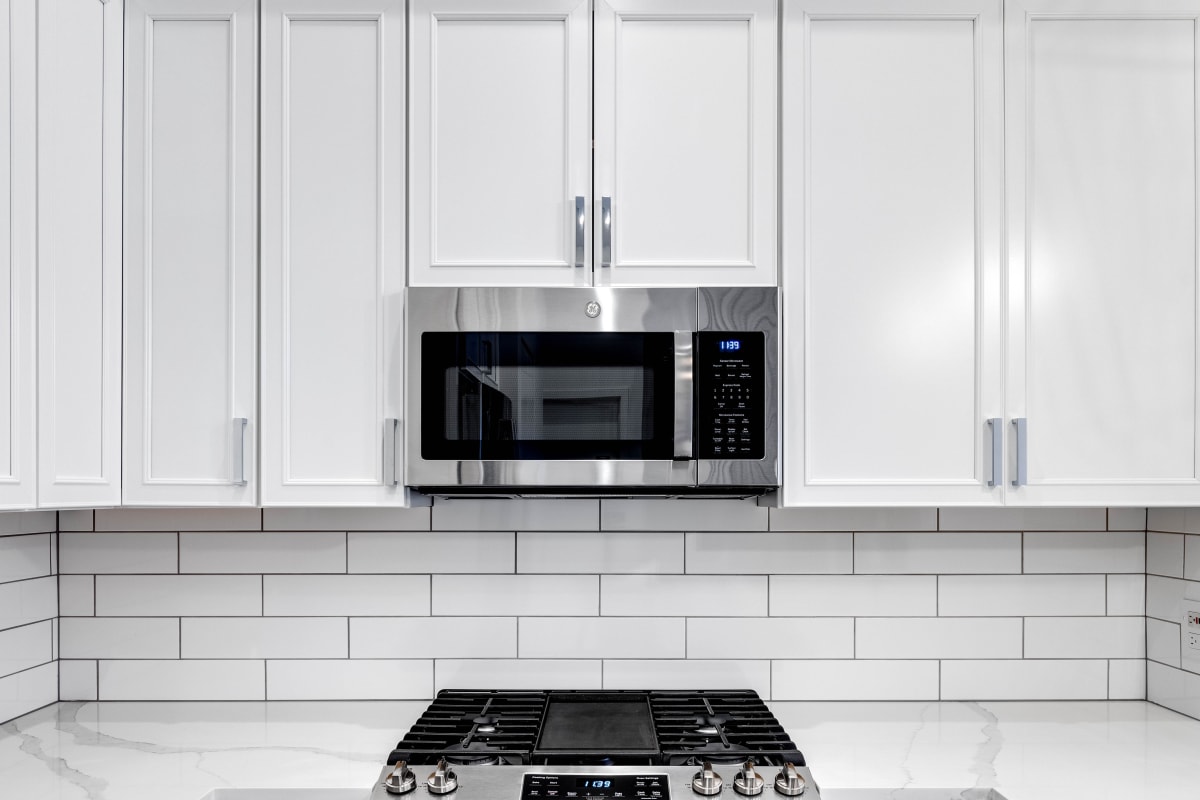 Model kitchen with white accents at The Bennett in Austin, Texas