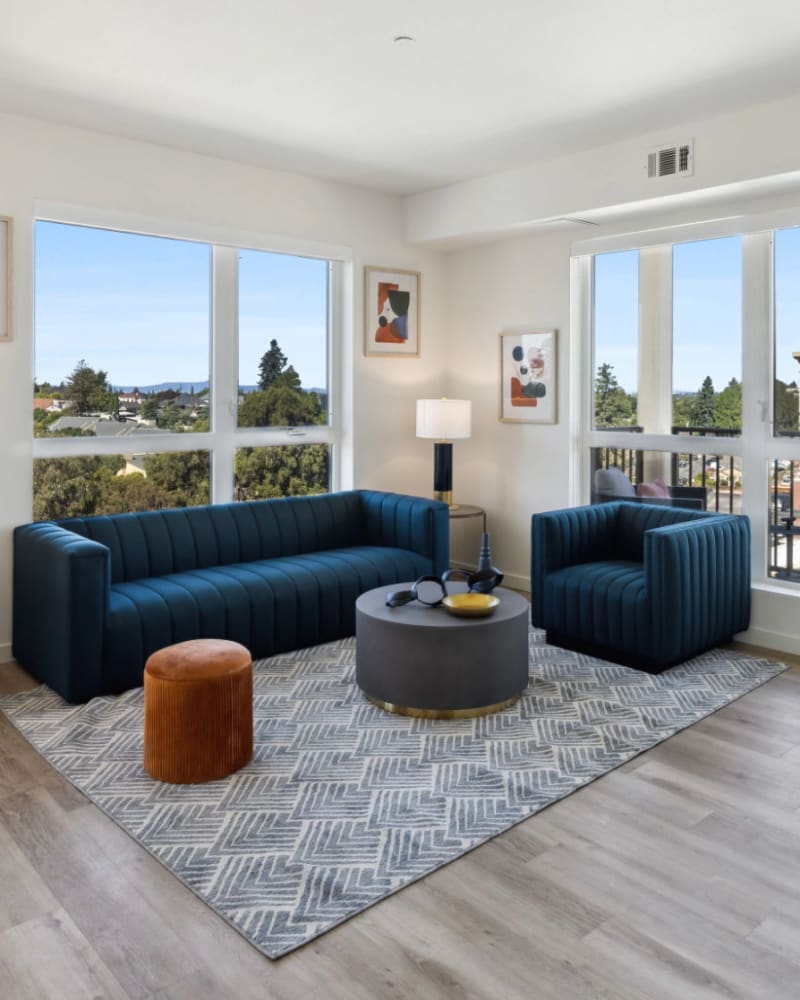 Large windows in an apartment living room at Lincoln Landing in Hayward, California