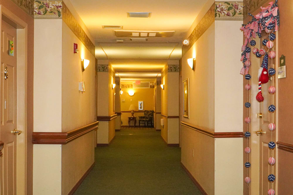 wide and nicely decorated hallways with seating at The Club at St. Cloud in St. Cloud, Florida