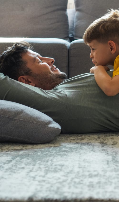 Resident relaxing with his son at Brighton Oaks in Houston, Texas