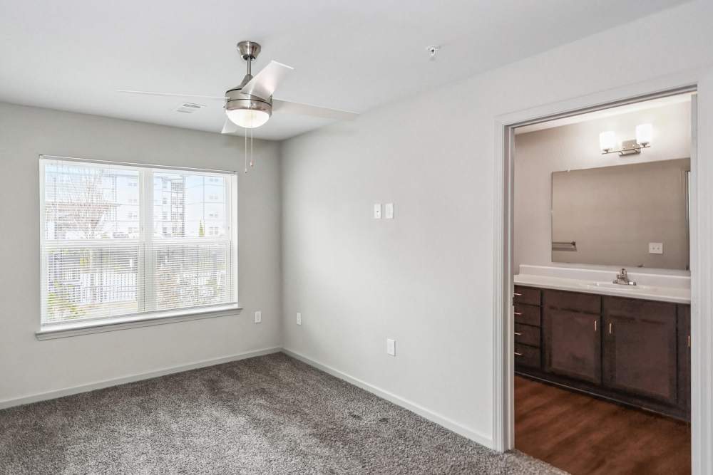 An unfurnished bedroom with attached bathroom at Flats at Mount Zion in Stockbridge, Georgia