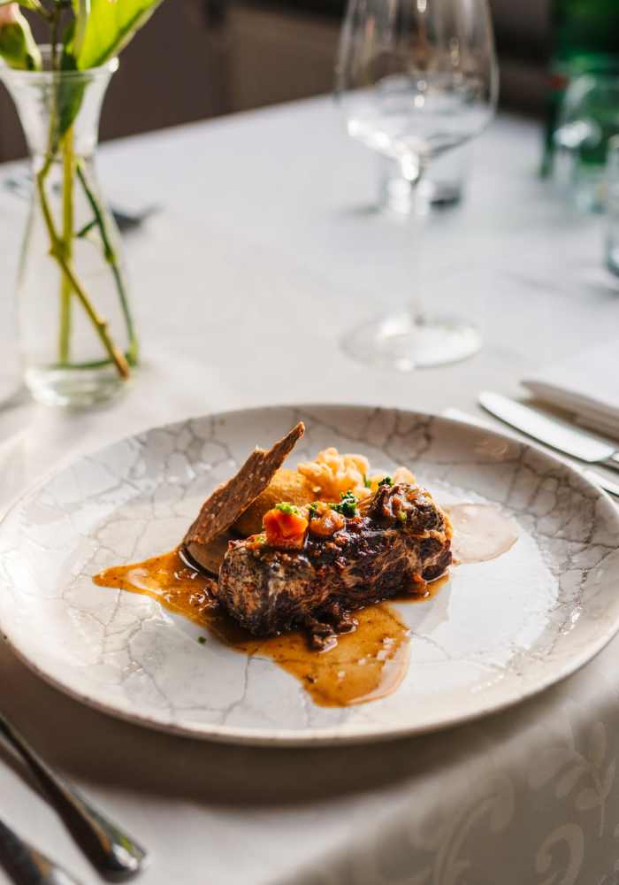 Beautifully plated meal in a restaurant near Venable Durham Apartments in Durham, North Carolina