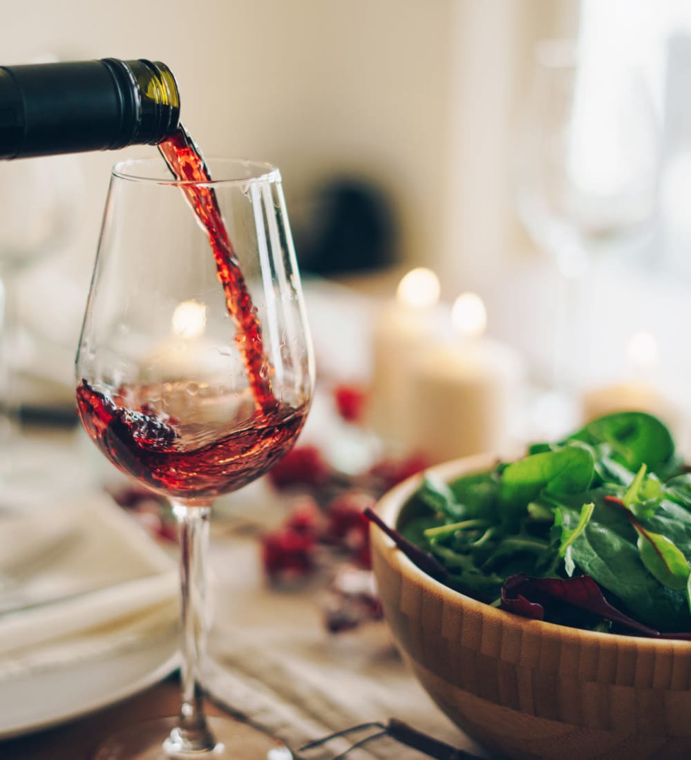 Resident having a glass of wine and dinner at a near by restaurant in West Haven, Connecticut