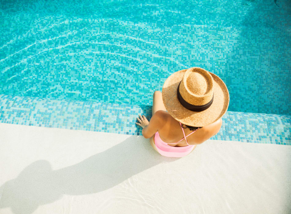 Resident relaxing poolside at The Marc, Palo Alto in Palo Alto, California