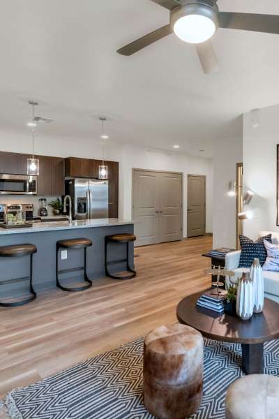 Spacious model apartment with wood-style flooring at Hangar at Thunderbird, Glendale, Arizona