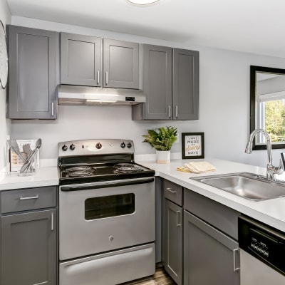 Modern kitchen with stainless-steel appliances in a model home at Sofi Lakeside in Everett, Washington
