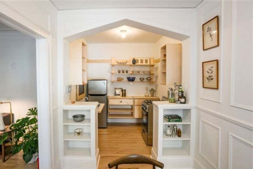 Apartment kitchen viewing from living room at Detroit Living in Detroit,Michigan