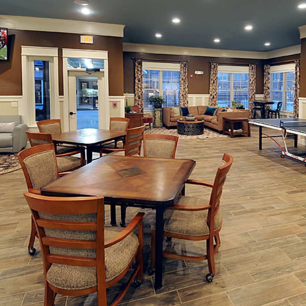 Cozy common area featuring stylish seating, inviting tables, and large windows at Avonlea Square in Smyrna, Georgia.