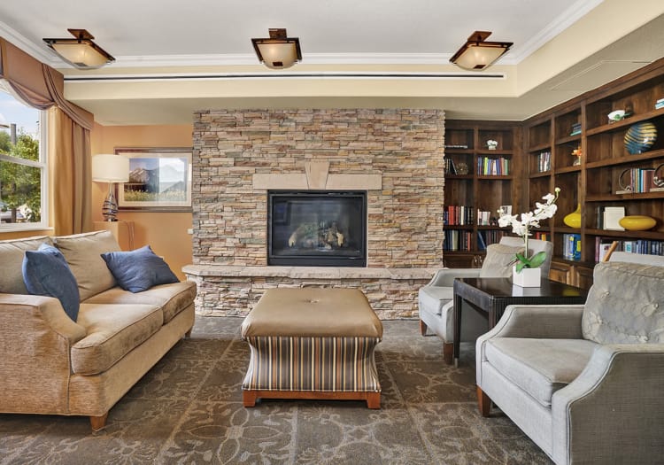 Lounging area in front of fire place at The Palisades at Broadmoor Park in Colorado Springs, Colorado