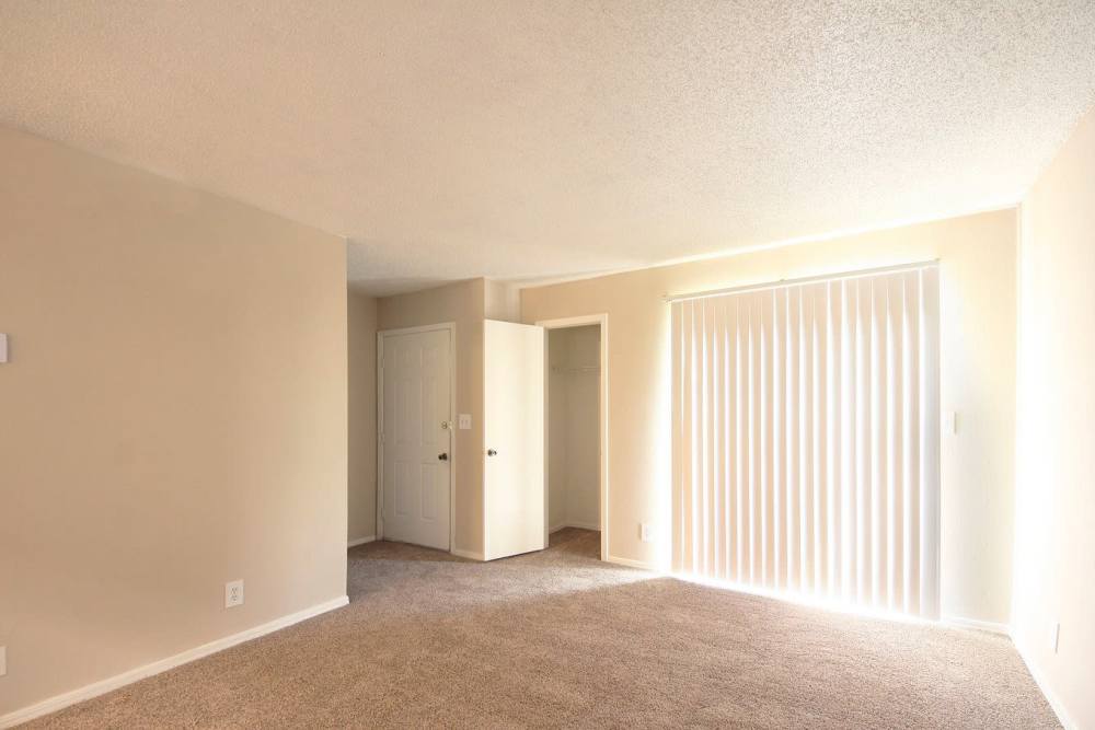 Unfurnished living room with view to kitchen at Stonebrook in Oklahoma City, Oklahoma