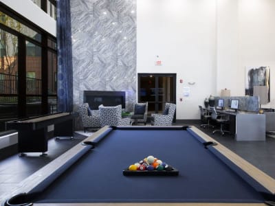 Pool table and shuffleboard in the modern resident clubhouse at Steelyard in Oklahoma City, Oklahoma