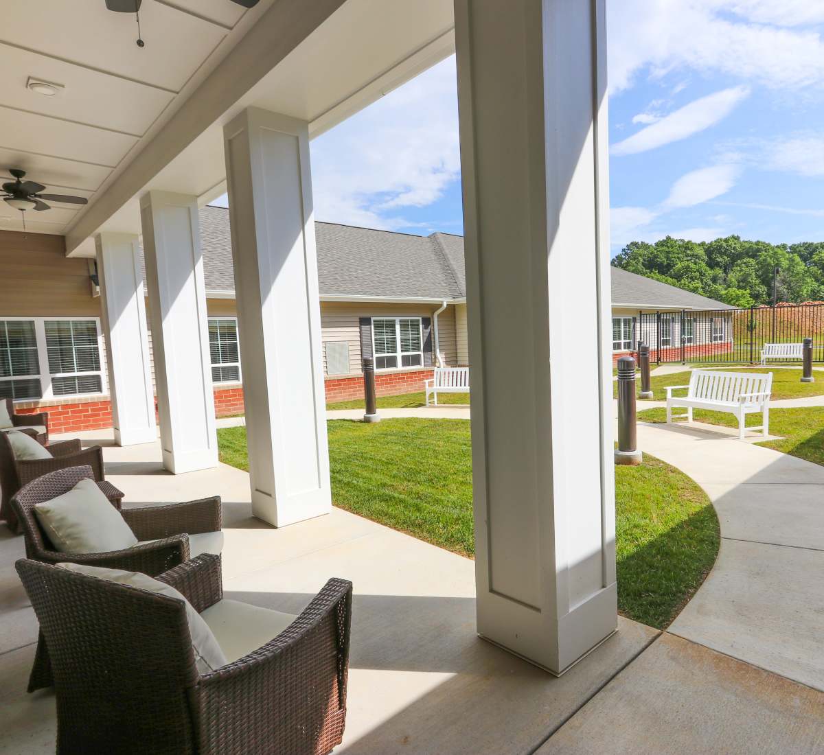 Beautiful exterior sitting area with a lawn and a walkway at Harmony at Oakbrooke in Chesapeake,Virginia