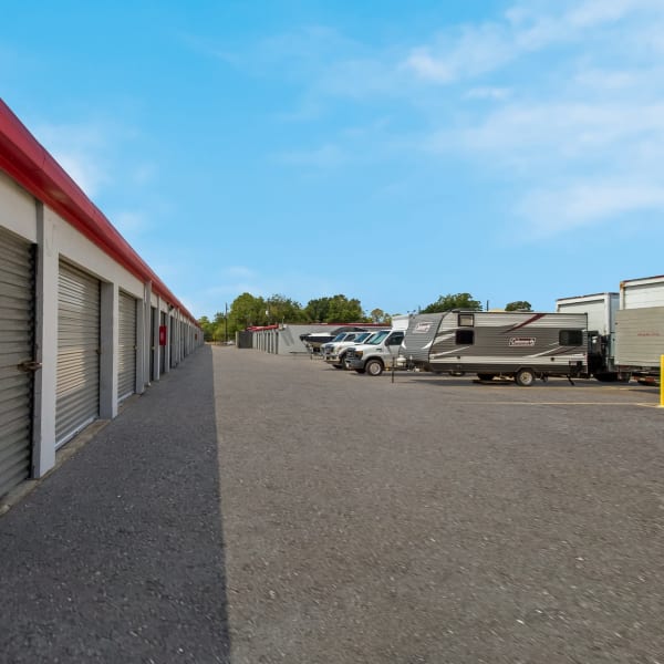 RVs and boats parked near outdoor storage units at StorQuest Economy Self Storage in Houston, Texas