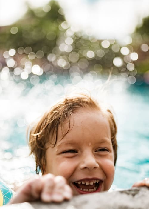 Child in the pool at Regency Johns Creek Walk in Johns Creek, Georgia