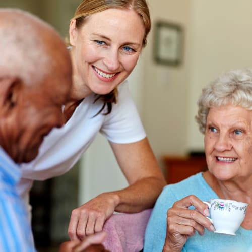 Residents talking over coffee at Oxford Springs Tulsa Memory Care in Tulsa, Oklahoma