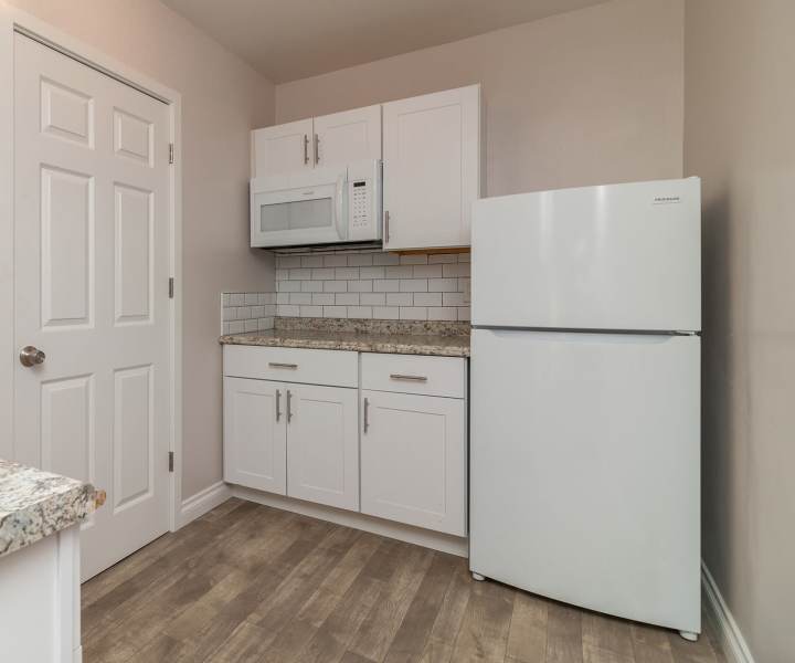 Kitchen with white appliances including refrigerator at Rosemead in San Gabriel, California 