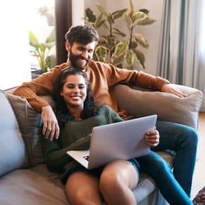 Resident couple on a video call in their new home at The Majestic at Hewitt in Hewitt, Texas