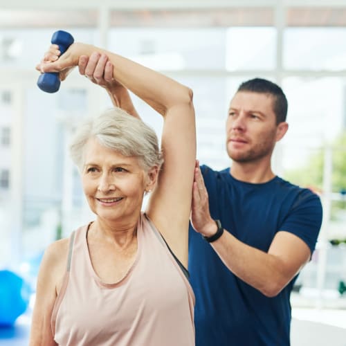 Women exercising with a trainer at Clearwater Living in Newport Beach, California