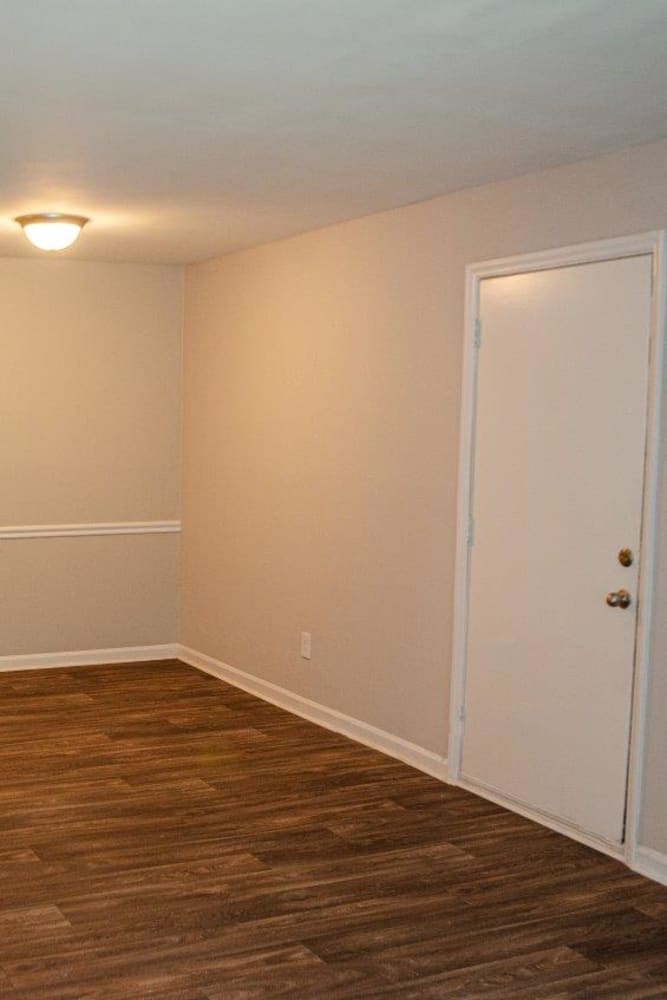 Wood style flooring in an apartment at Georgetowne Woods in Gastonia, North Carolina