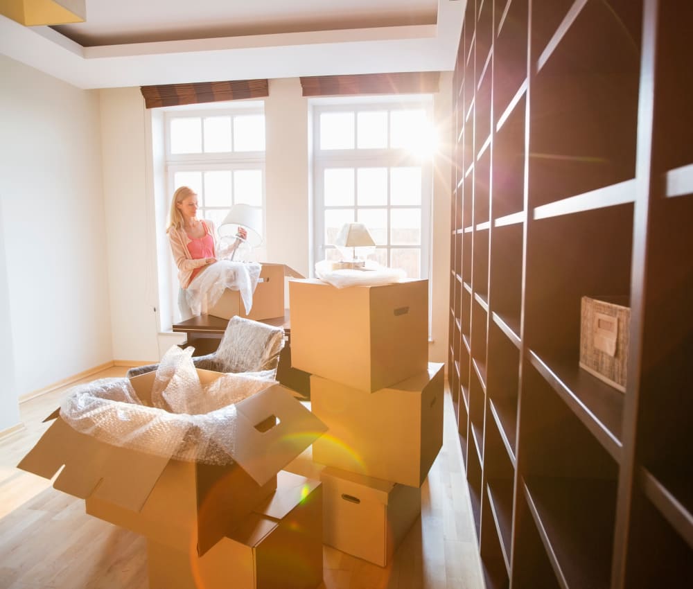 Woman packing their things at Garden Self Storage in Laurel, Mississippi