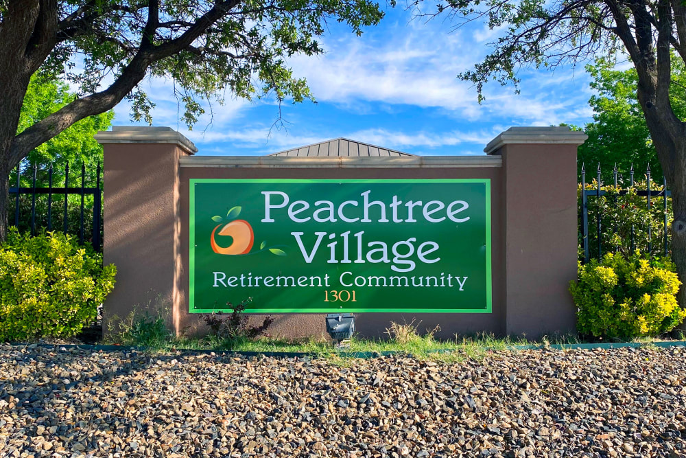 The front sign on a sunny day at Peachtree Village Retirement Community in Roswell, New Mexico. 