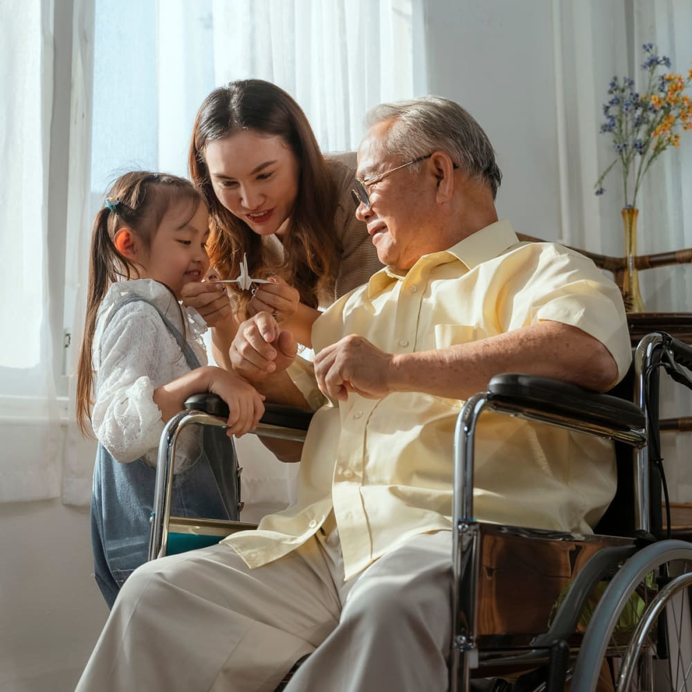 A resident and his grandchildren at The Ridge at Lansing in Lansing, Michigan