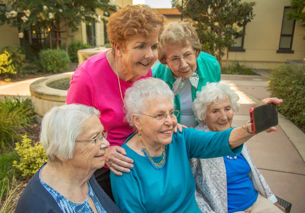 Senior ladies taking a selfie at Merrill Gardens at Campbell in Campbell, California.