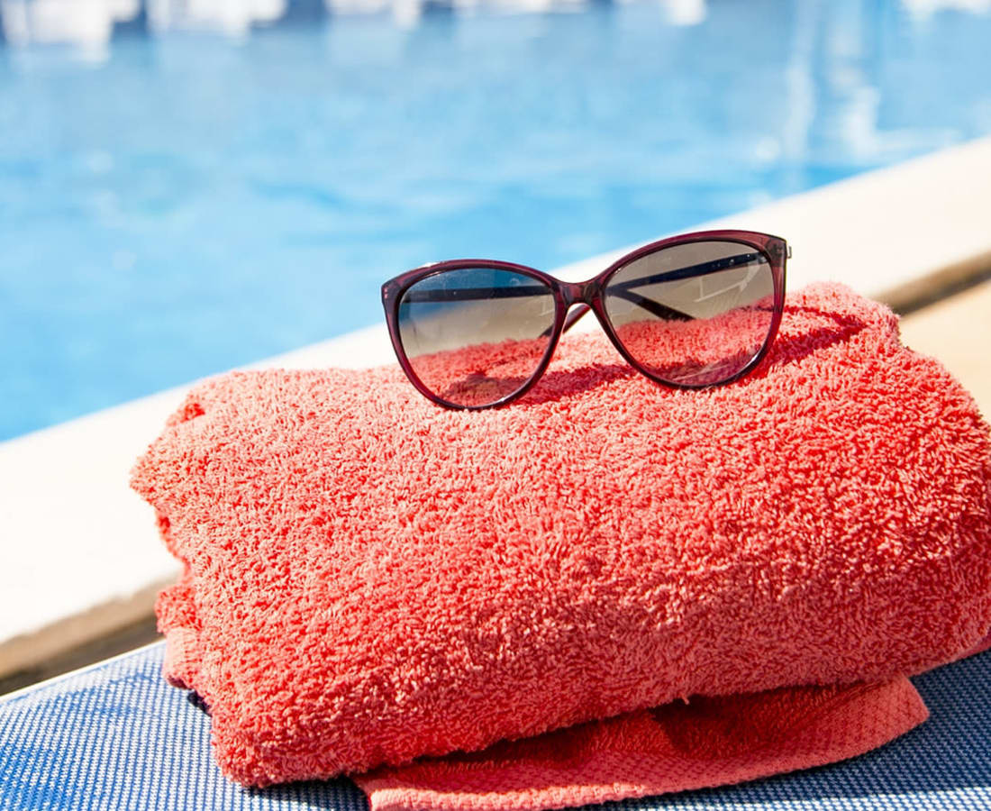 Sunglasses resting on a towel at Haven Hill Exchange in Atlanta, Georgia