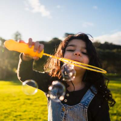 Resident paddleboarding with their dog at Avenue at Converse in Converse, Texas