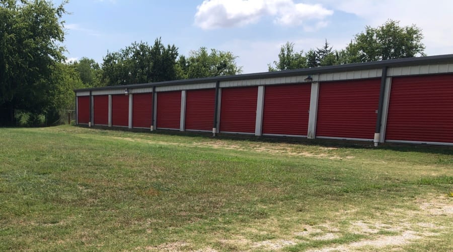 A parent playing with a child in a moving box near KO Storage in Talco, Texas