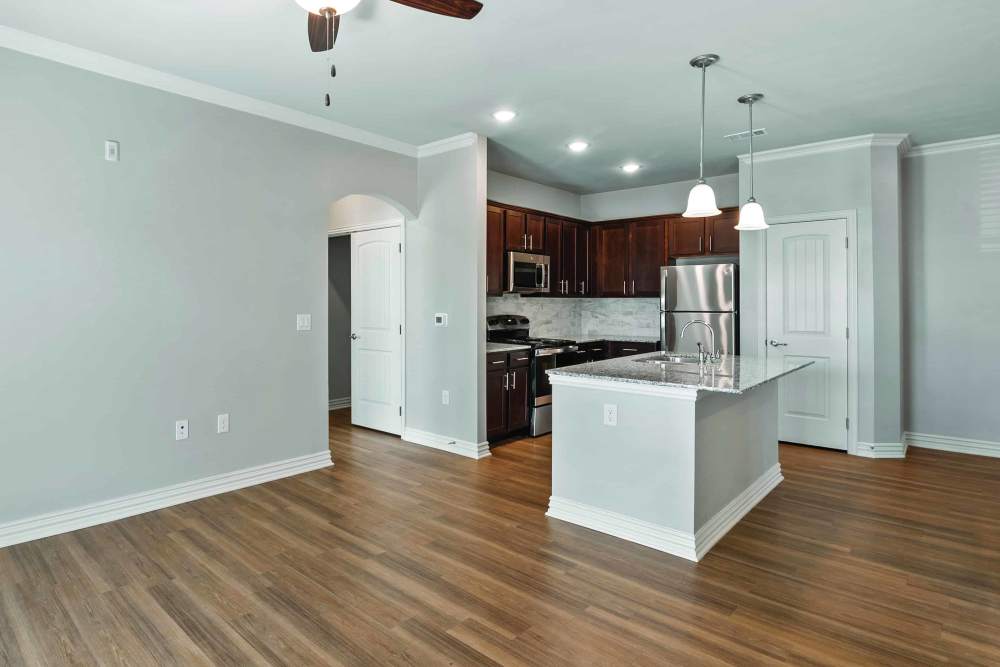 Unfurnished living room and kitchen at Stonebridge Apartment Homes in Lufkin,Texas