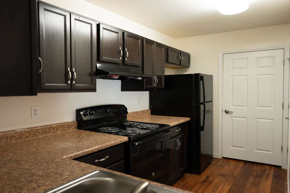 Kitchen with black colored appliances at Fairway Breeze in El Reno, Oklahoma