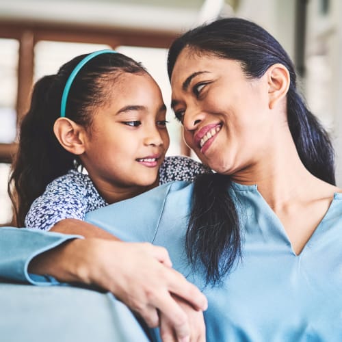 A happy mother with her daughter at The Village at NTC in San Diego, California