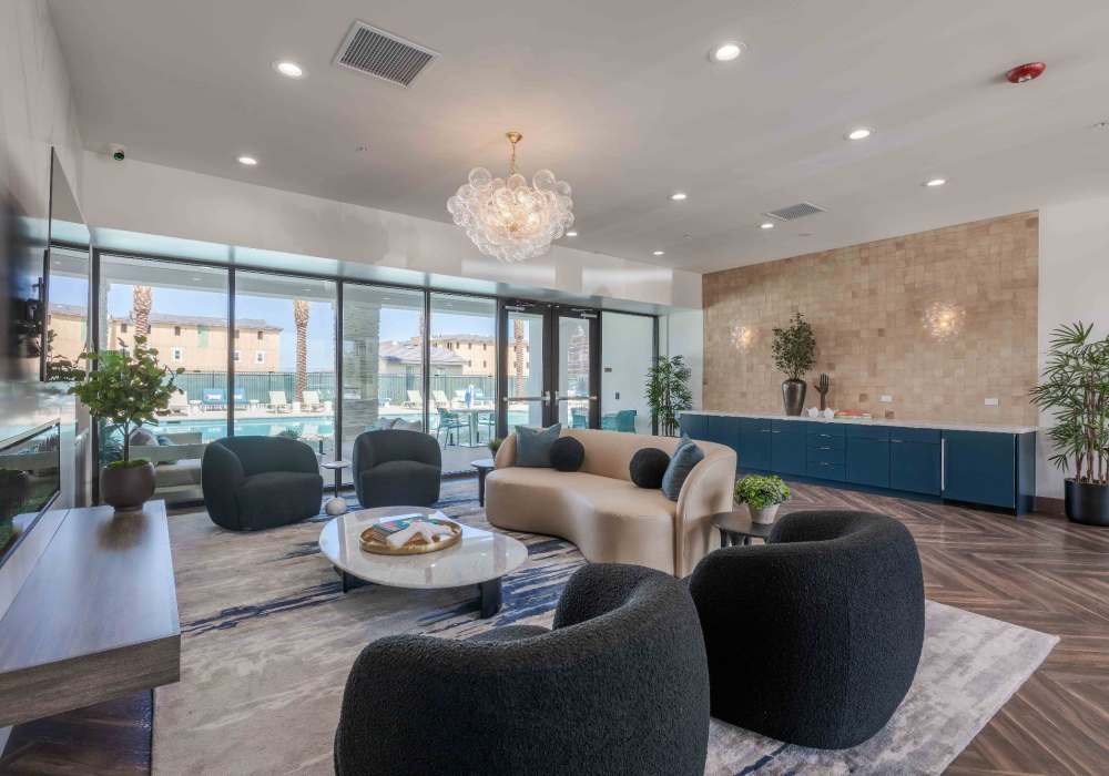 Clubhouse with view of luxury pool at Desert Meadows Apartments & Townhomes in Lancaster, California