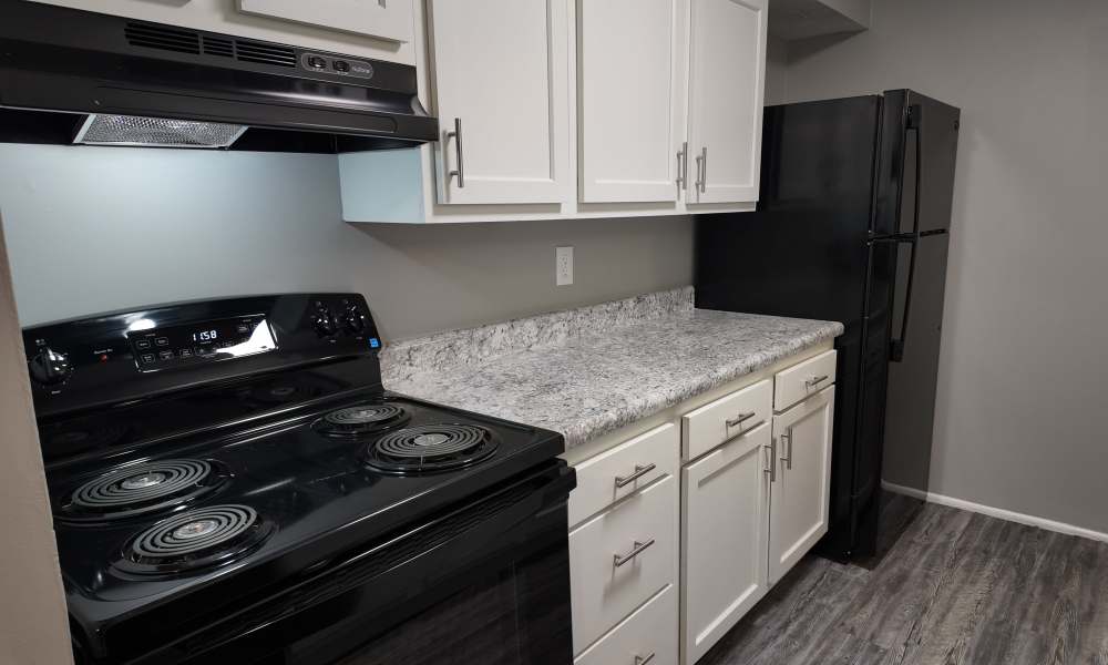 Kitchen with white cabinetry at Pike Place KY in Highland Heights, Kentucky