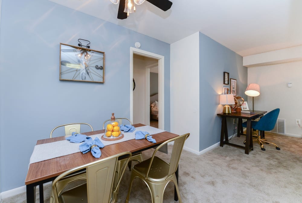 Dining area with a ceiling fan at Country Village Apartment Homes in Dover, Delaware