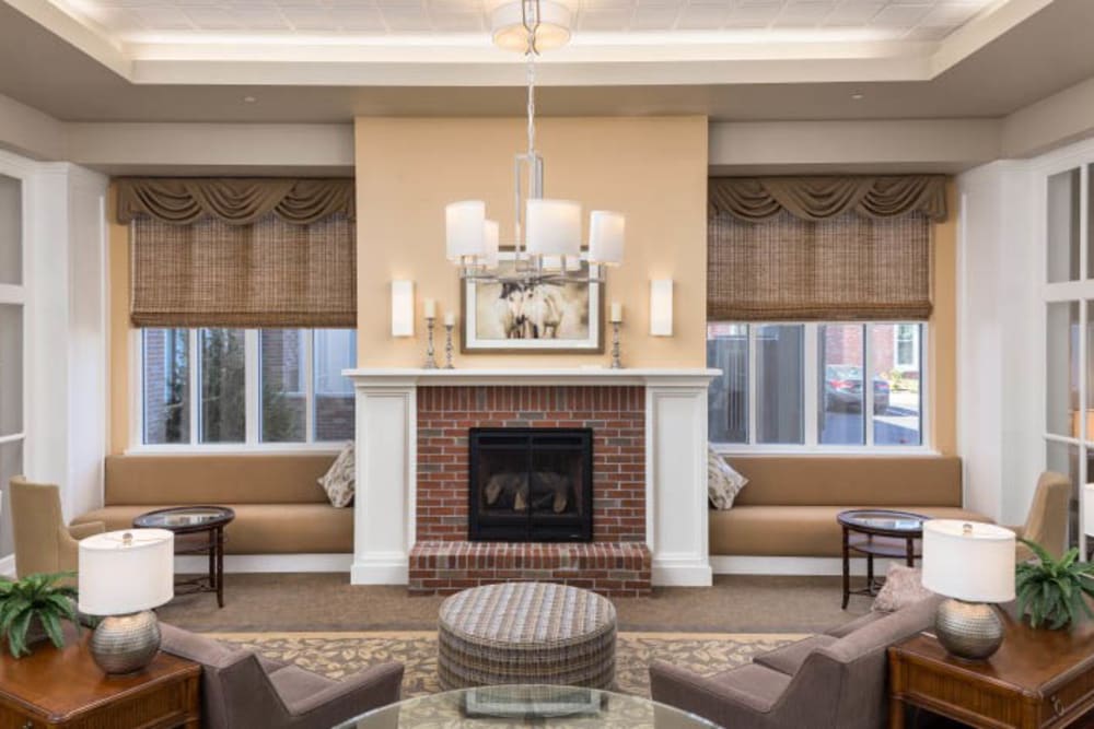 Lounge with fireplace at Merrill Gardens at Madison in Madison, Alabama. 